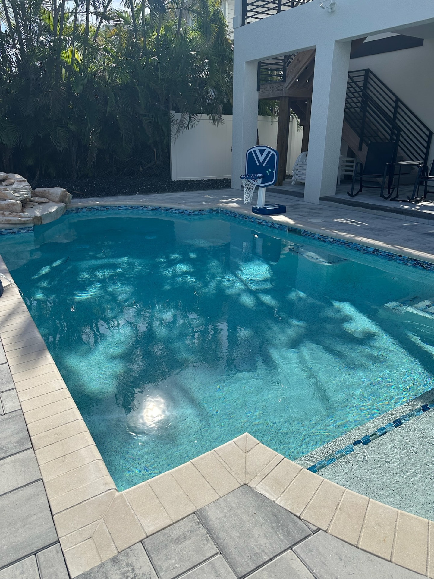 Rock waterfall and glass waterline tile
