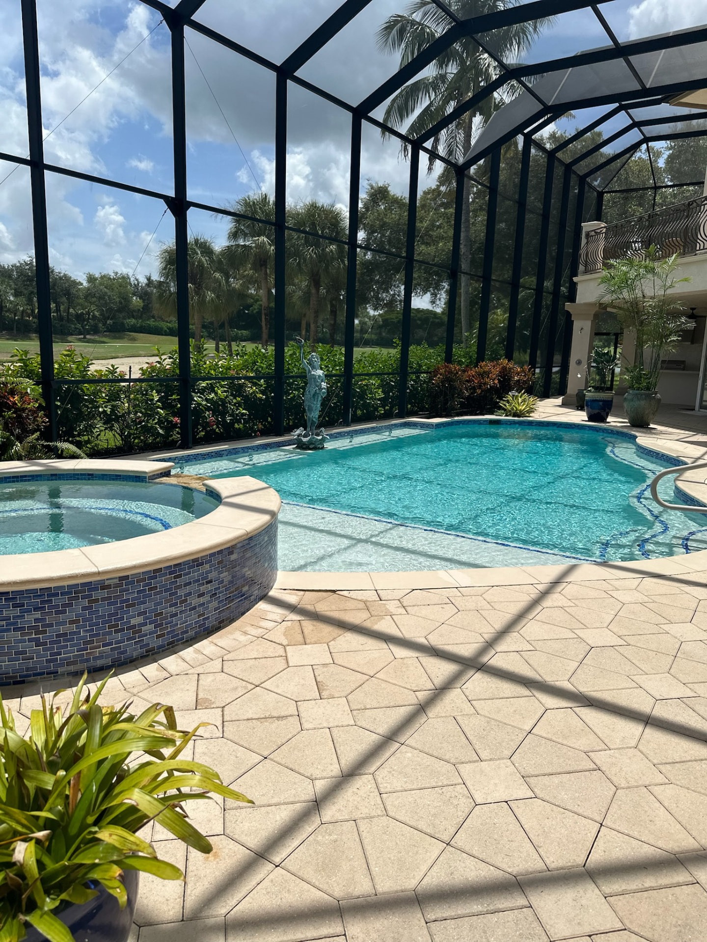 Raised spa with travertine decking